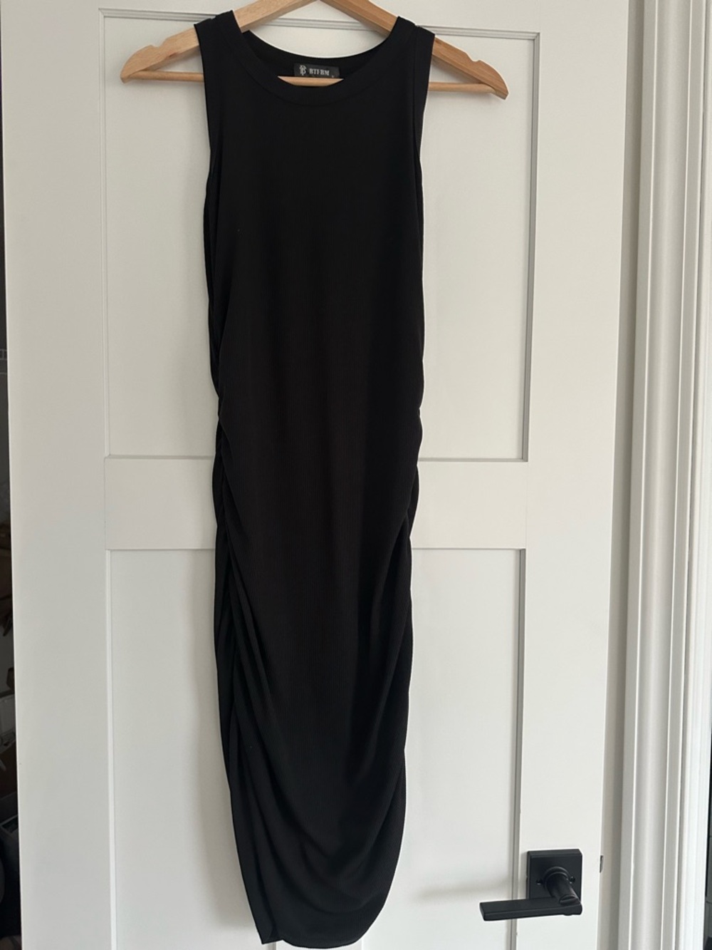 Sleeveless Black Midi Dress with Side Draping